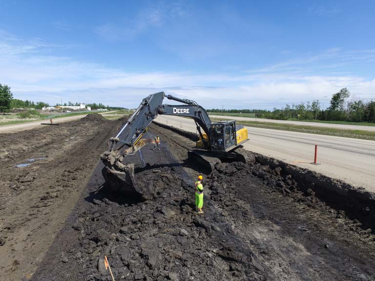 Excavator Digging - Road Construction Services - Iron Pine Contracting, Grande Prairie